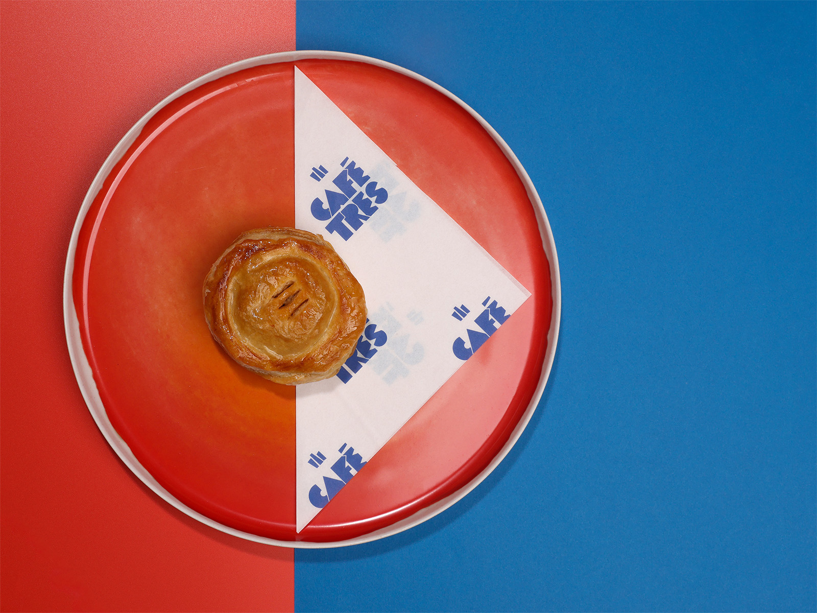 A pastry on a red plate