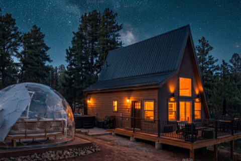 A mountain cabin with a stargazing dome