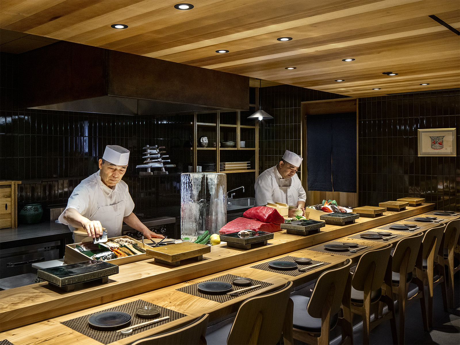 Sushi chefs behind a sushi counter