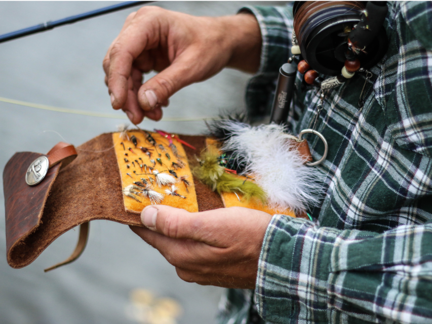 Fly fishing wallet holding flies 