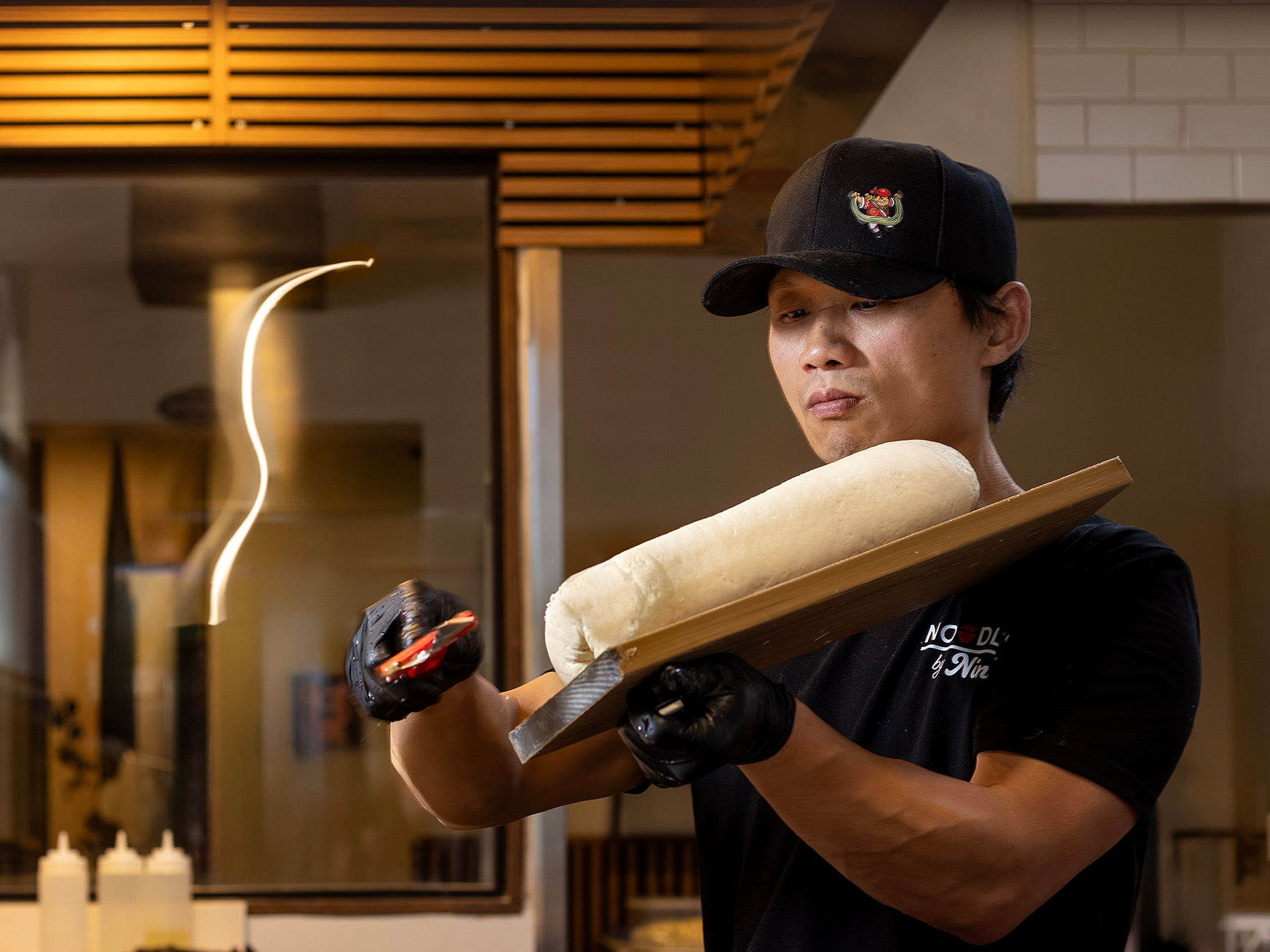 Chef Sunny Sun making knife-sliced noodles