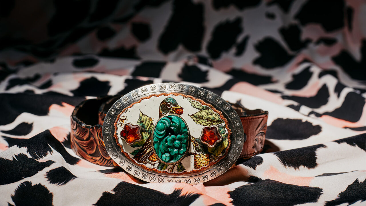 A turquoise-studded belt buckle from Sweet Bird Studio