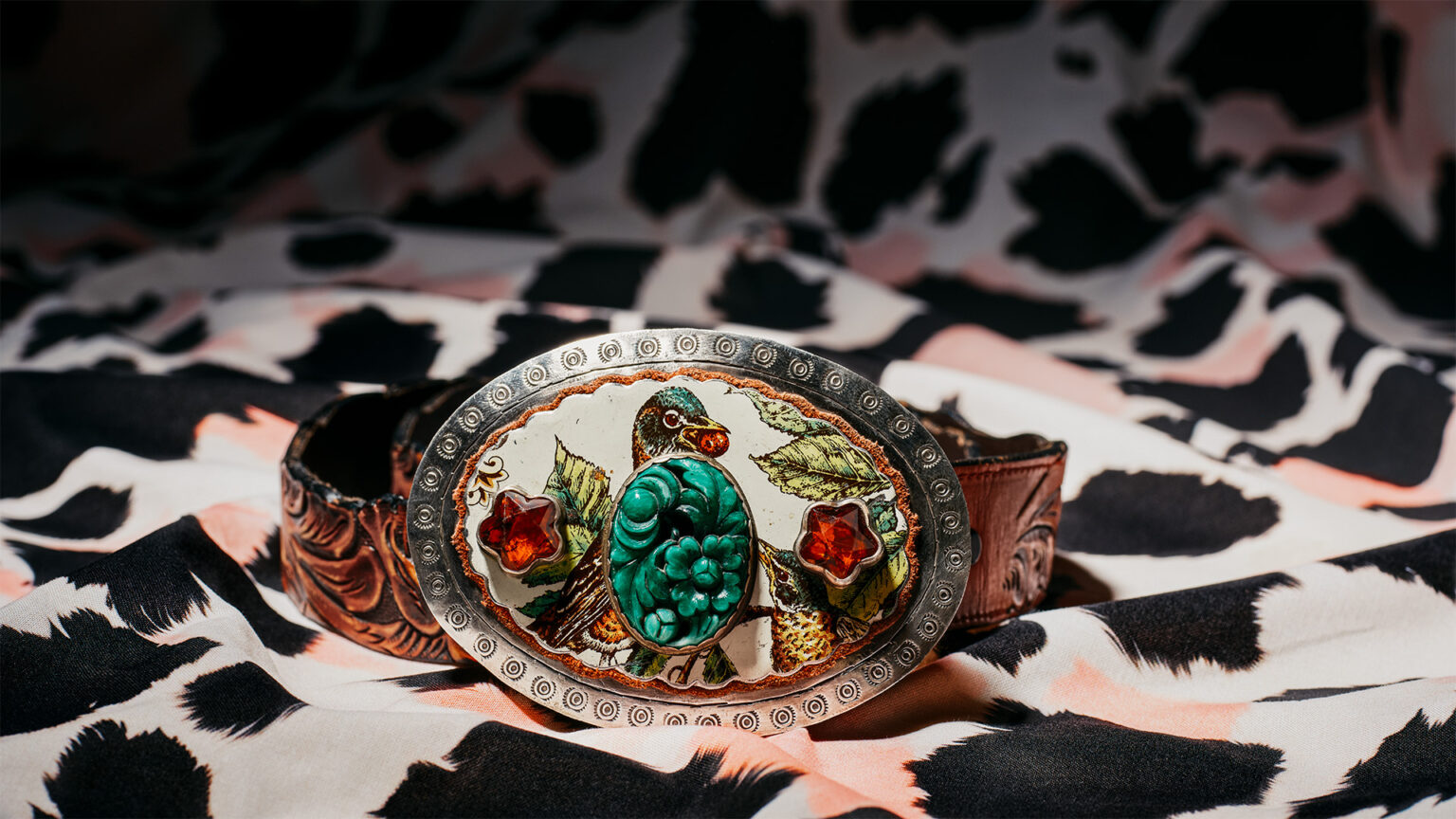 A turquoise-studded belt buckle from Sweet Bird Studio