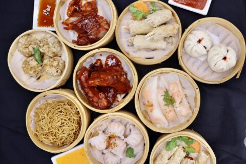 Multiple Chinese dim sum items in steamer baskets