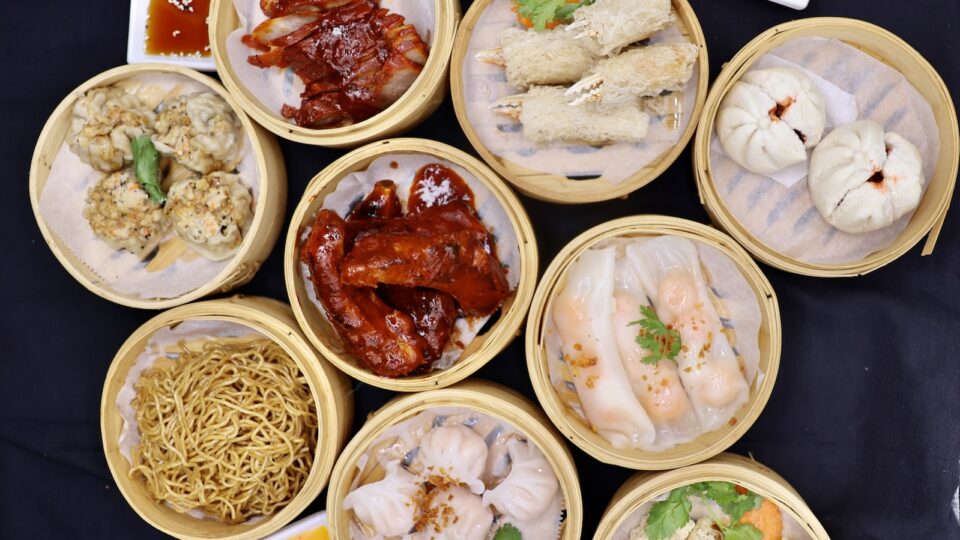 Multiple Chinese dim sum items in steamer baskets