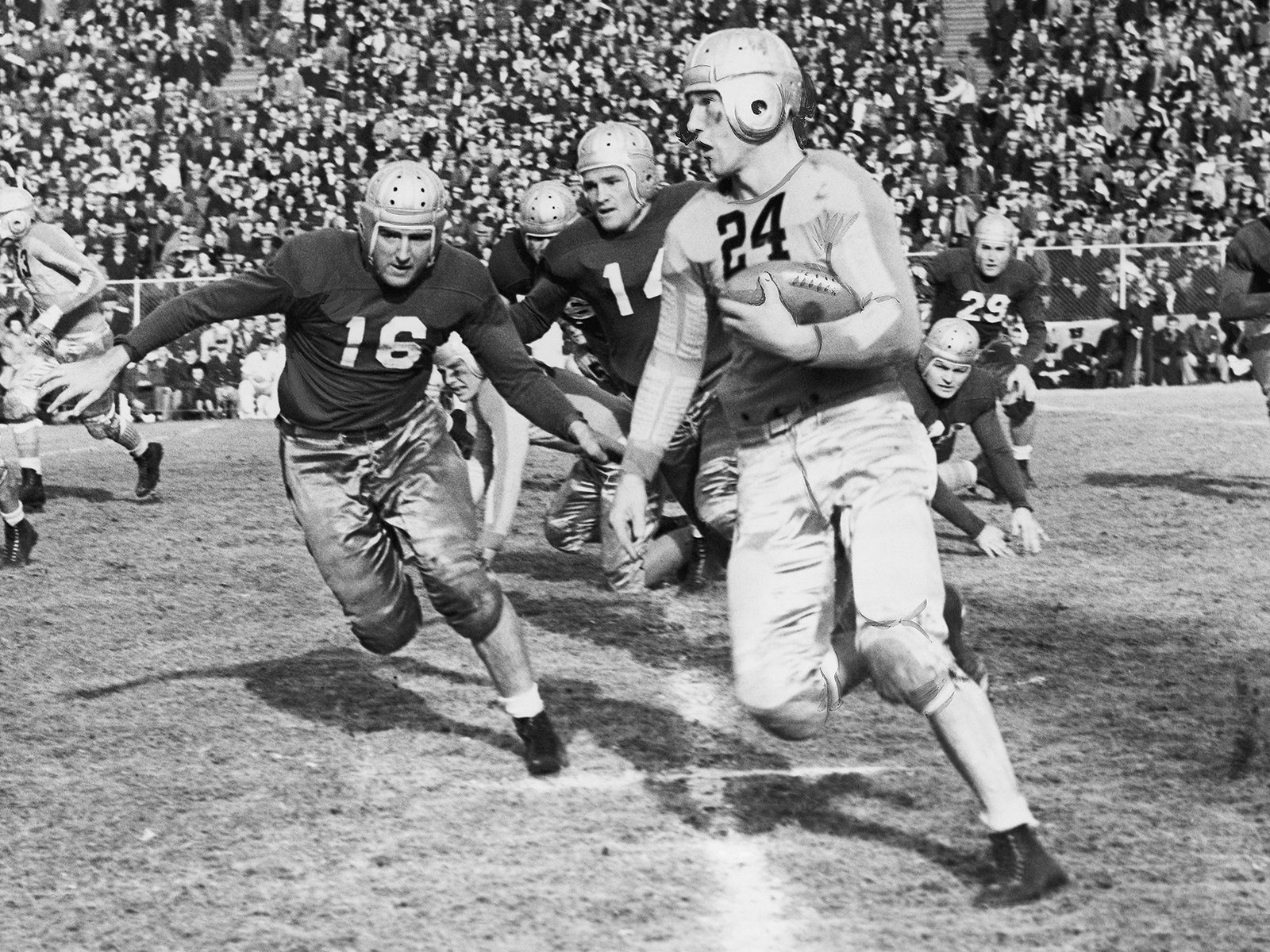 University of Colorado halfback Byron White runs the ball in a black-and-white photo