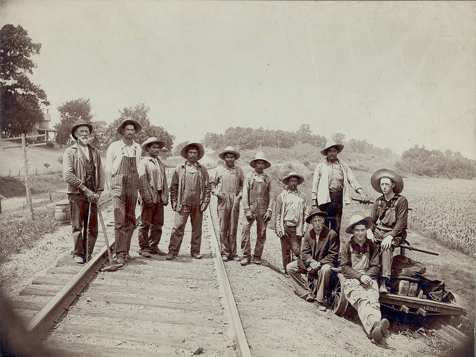 A photo of workers laying train tracks