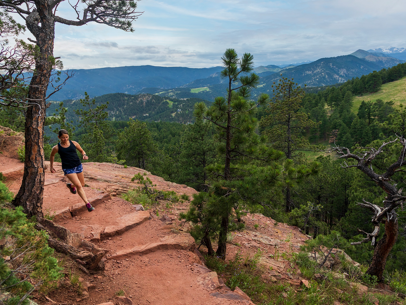 A trail runner on Mt. Sanitas in Boulder, Colorado