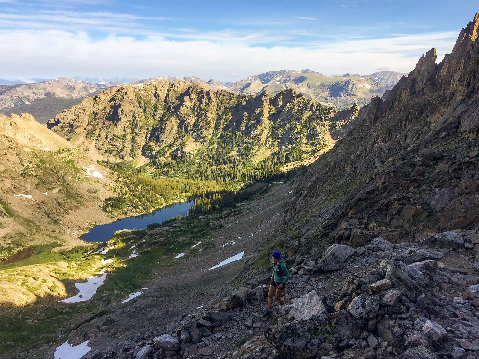 A trail runner on the west side of the Continental Divide at Pawnee Pass along the Boulder Double Bypass Loop in Colorado