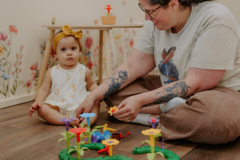 A mother and child play at Baby University’s grand opening
