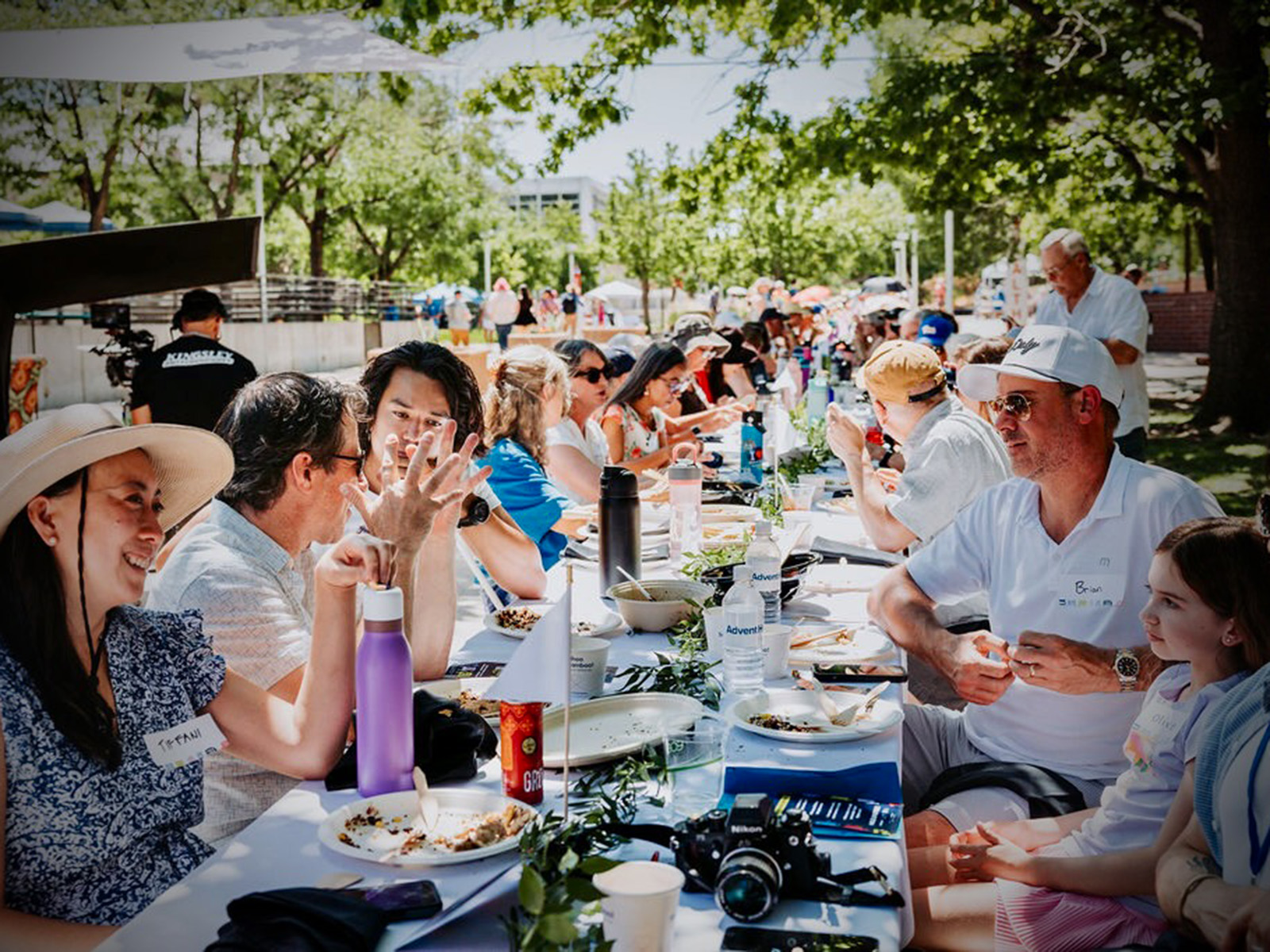 People chat at an outdoor table