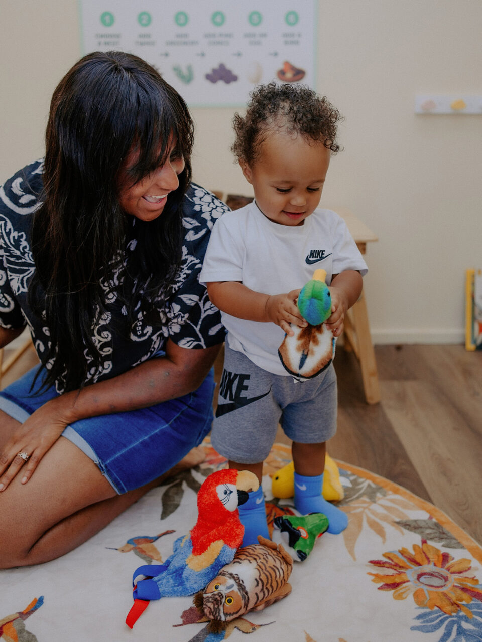 A mother and child play in the Bird’s Nest room