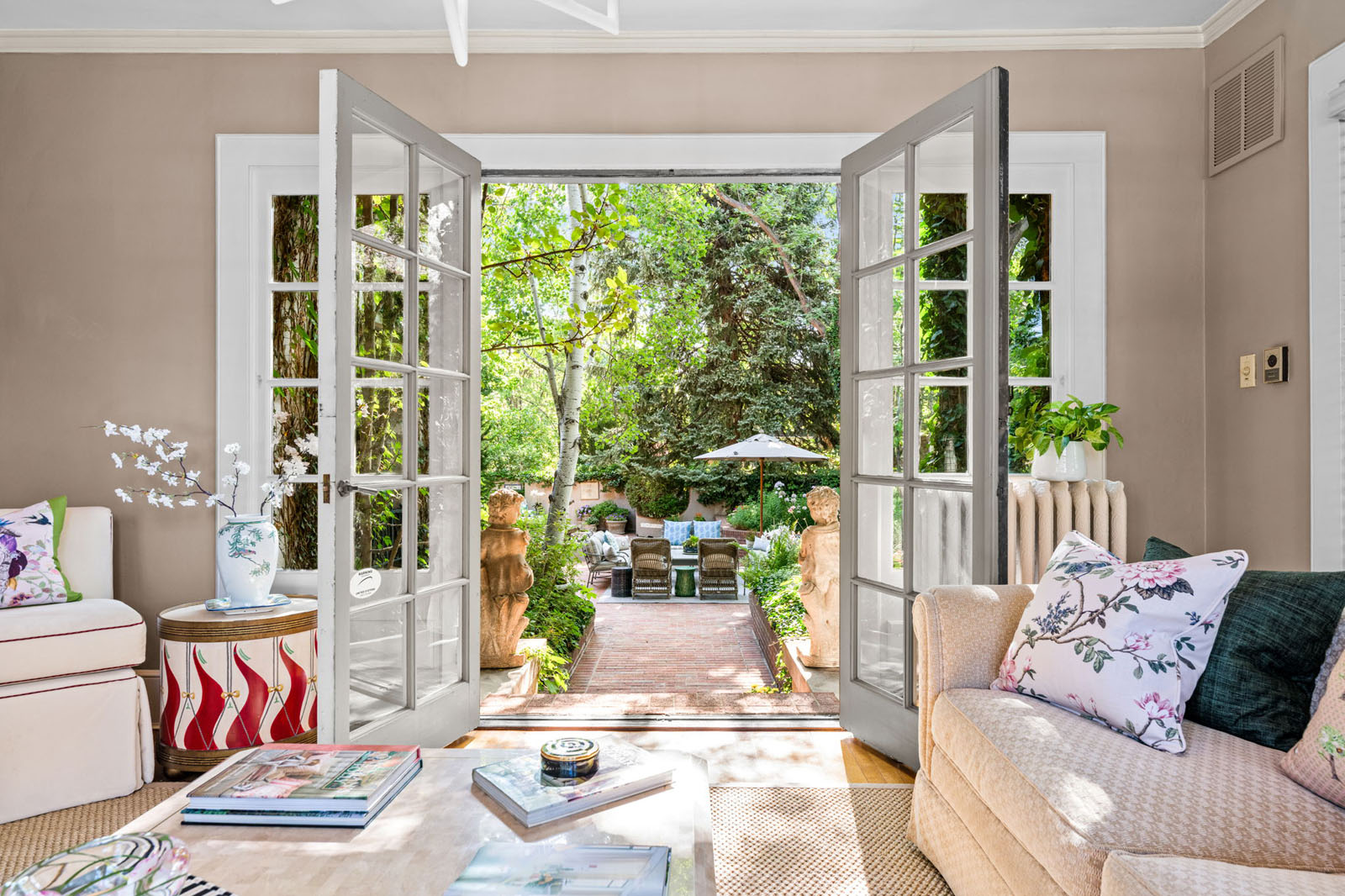 French doors open to a garden