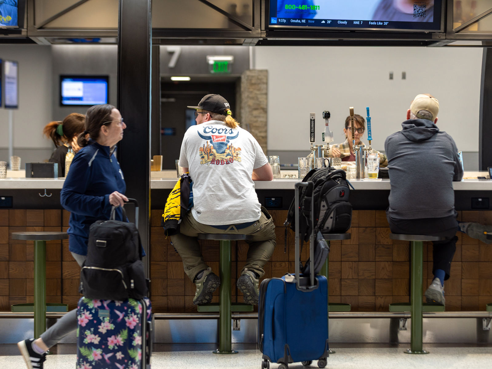 People bellying up to the Craft bar in the Colorado Springs Airport