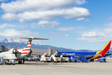Two airplanes on the runway at Colorado Springs Airport