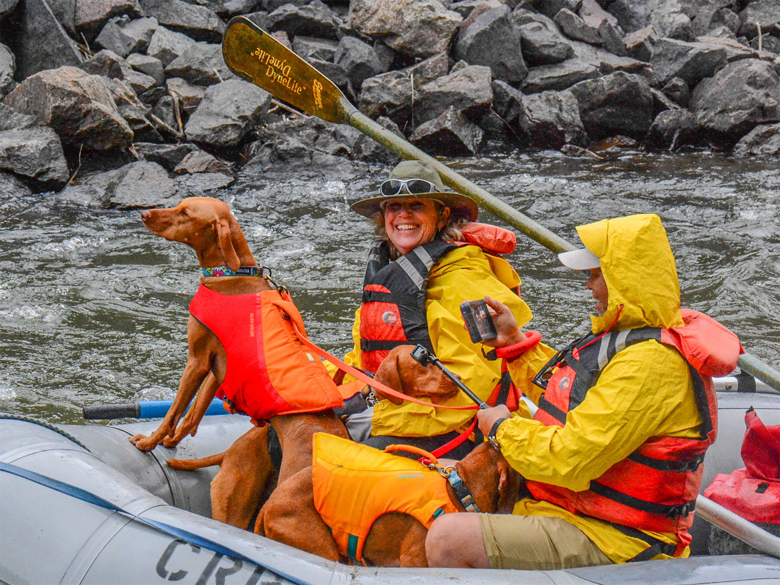 A woman in a raft with three Viszlas 