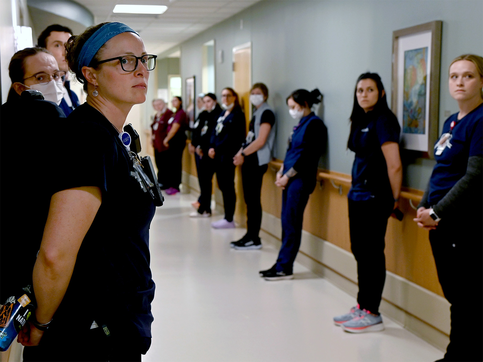 Health professionals lining a walkway