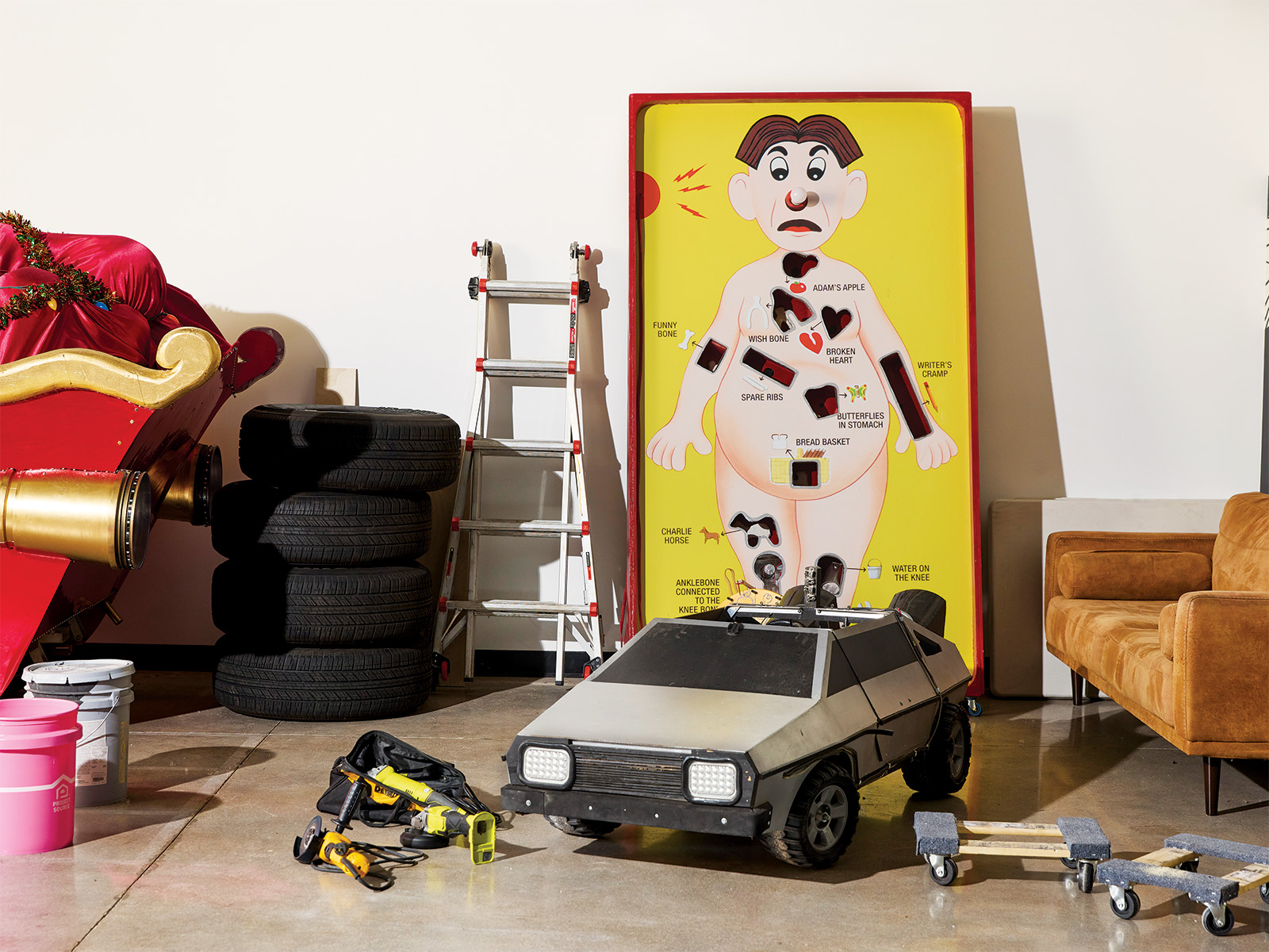 A giant Operation board game and tires and other props