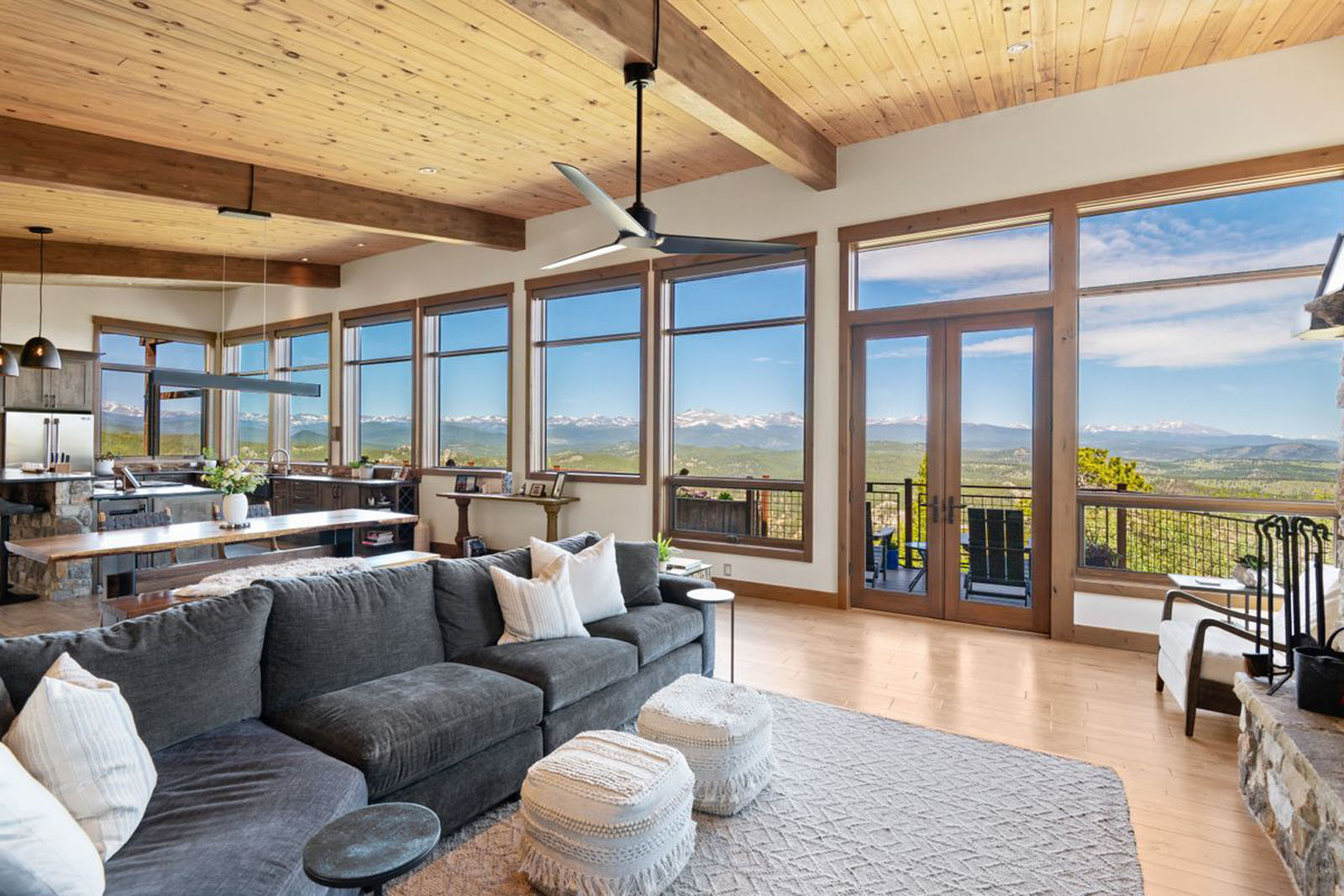 Open-concept living room with wall of windows