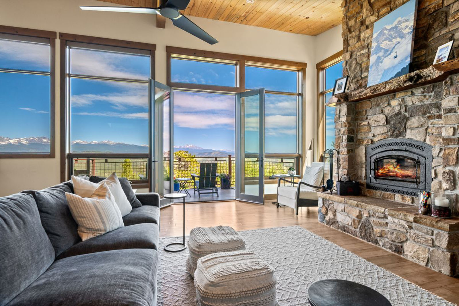 Living room with doors open to a large deck