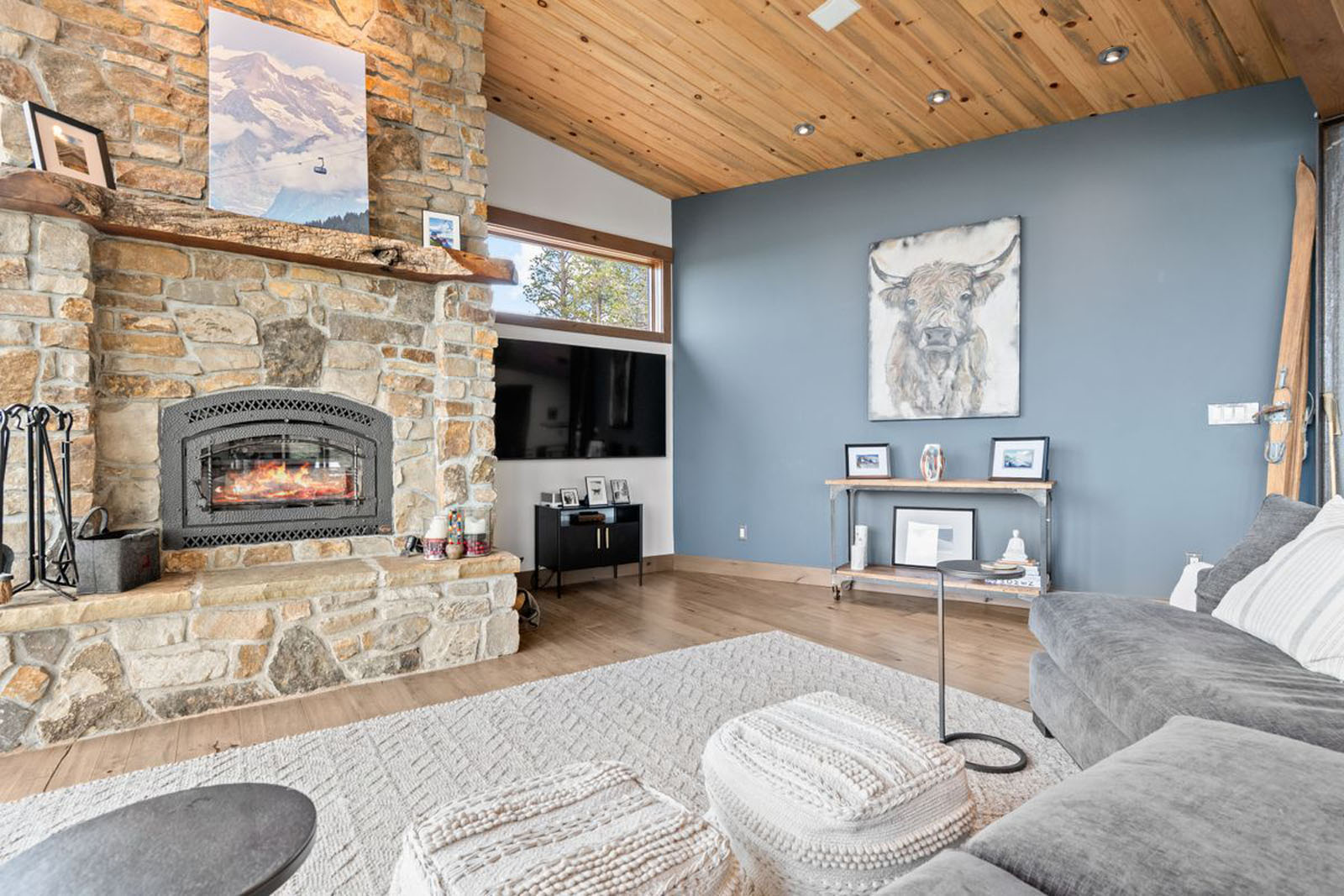 Living room with a stone fireplace