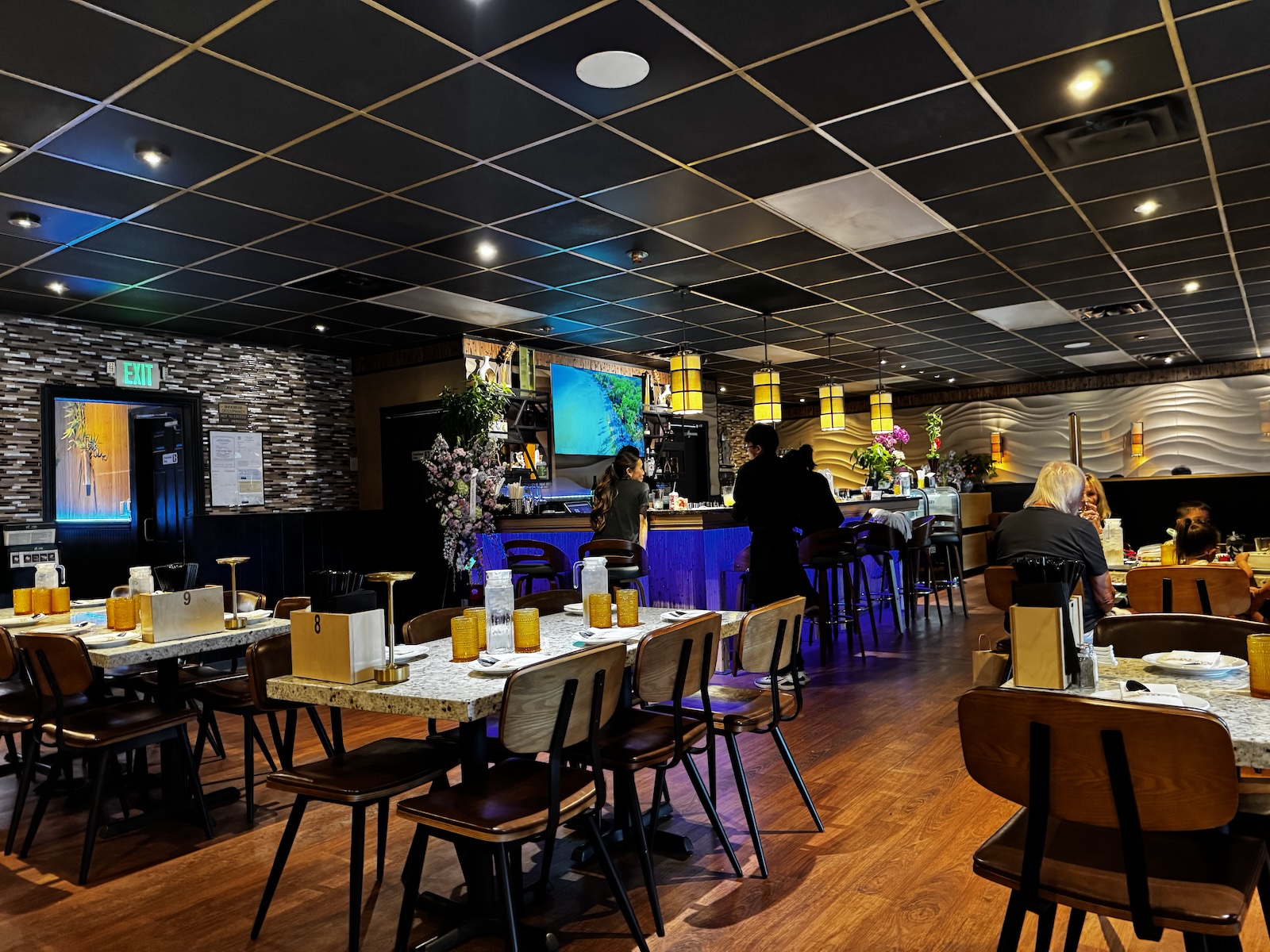 The sleek and modern bar and dining room of a new Vietnamese restaurant.