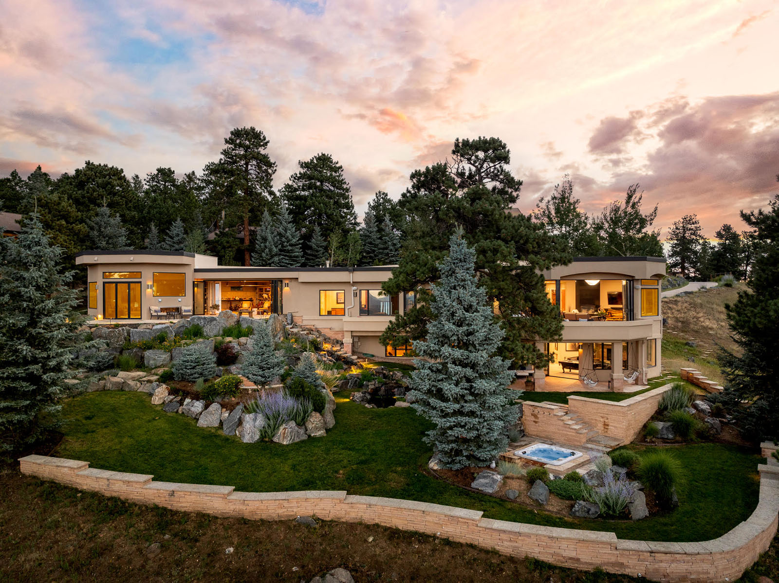 Exterior of a two-story modern home built into a hillside