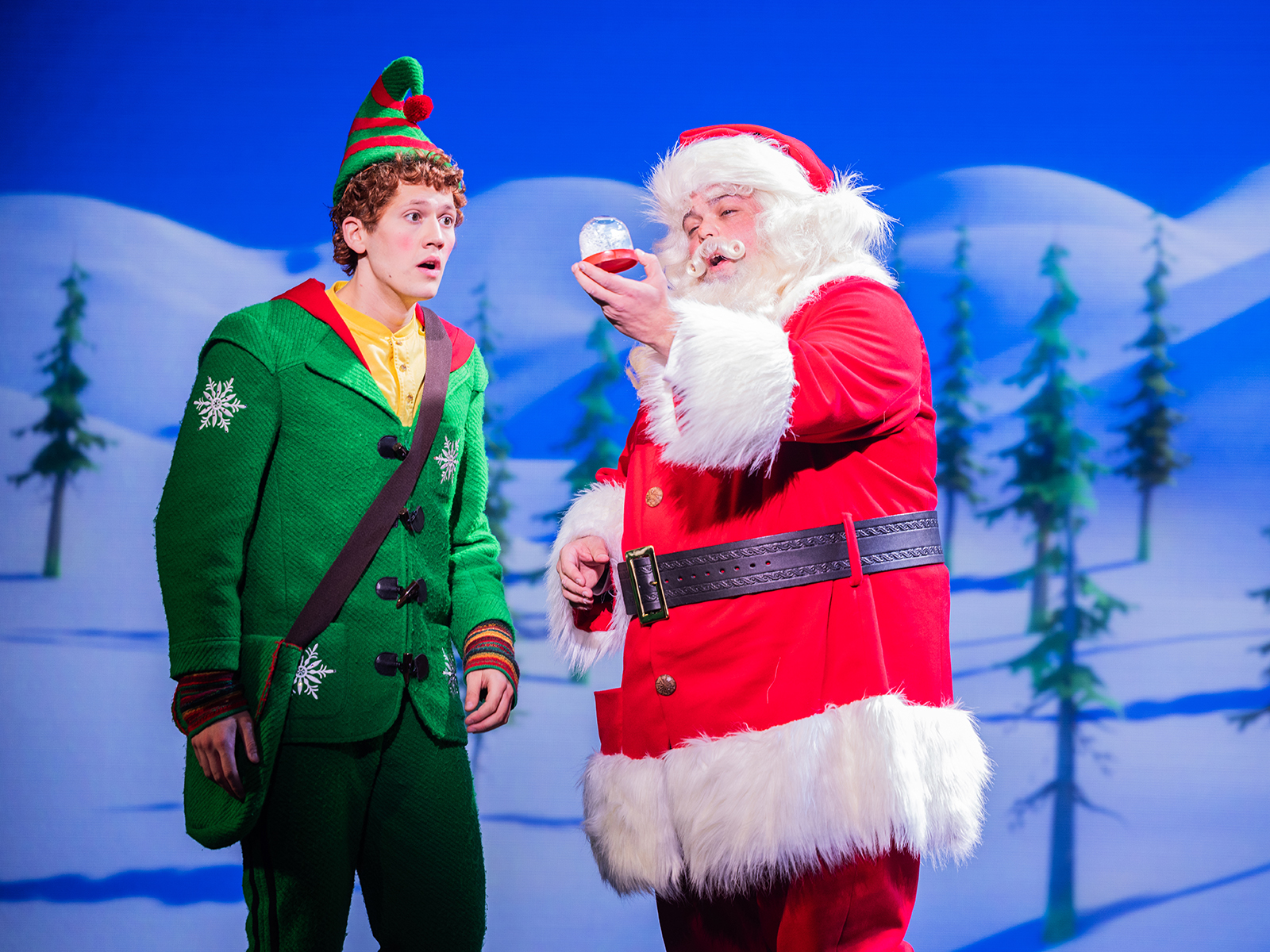 An elf and Santa in a production of “Elf the Musical”